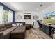 Comfortable living room with a plush sectional sofa and a mounted television at 2251 Evenglow Ave, Spring Hill, FL 34609