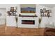 Cozy living room featuring a modern fireplace, decorative shelves, and stylish accents enhancing the inviting space at 2251 Evenglow Ave, Spring Hill, FL 34609