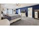 Spacious main bedroom features a tray ceiling, a ceiling fan, and light gray carpet at 2251 Evenglow Ave, Spring Hill, FL 34609