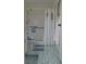 Bathroom features a walk-in shower, modern fixtures, and updated tile flooring at 2261 Swedish Dr # 37, Clearwater, FL 33763