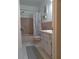 Cozy bathroom with a single sink vanity and tub and shower combo at 2261 Swedish Dr # 37, Clearwater, FL 33763