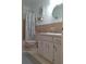 Bathroom features a single sink vanity and tub and shower combo with decor at 2261 Swedish Dr # 37, Clearwater, FL 33763