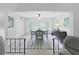 Light and airy dining room featuring a large window and stylish furnishings at 2261 Swedish Dr # 37, Clearwater, FL 33763