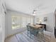 Dining room features a charming table, artwork, and a window with natural light at 2261 Swedish Dr # 37, Clearwater, FL 33763