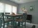 Dining room with a farmhouse-style table, seating for six, and bright natural light at 2261 Swedish Dr # 37, Clearwater, FL 33763