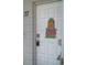 Inviting front door with a decorative pineapple, 'food, music, fun' sign, and visible unit number at 2261 Swedish Dr # 37, Clearwater, FL 33763