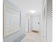 Hallway view with a hall closet, a mirror, and easy access to kitchen area in the home at 2261 Swedish Dr # 37, Clearwater, FL 33763