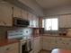 Well-lit kitchen featuring ample cabinetry, modern appliances, and a functional layout at 2261 Swedish Dr # 37, Clearwater, FL 33763