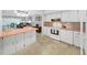 Kitchen view overlooking into living spaces and featuring white appliances and ample counter space at 2261 Swedish Dr # 37, Clearwater, FL 33763