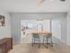Bright kitchen featuring white cabinets and a contrasting coral island with bar stool seating at 2261 Swedish Dr # 37, Clearwater, FL 33763