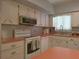 Bright kitchen with a clean design, including ample storage and updated appliances, perfect for cooking at 2261 Swedish Dr # 37, Clearwater, FL 33763