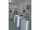 Laundry room with commercial washers and sink at 2261 Swedish Dr # 37, Clearwater, FL 33763