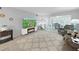 Cozy living room with an electric fireplace, neutral decor, and a view of the dining area at 2261 Swedish Dr # 37, Clearwater, FL 33763