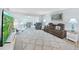 Open-concept living room with plush seating, decorative rug, and bright natural light at 2261 Swedish Dr # 37, Clearwater, FL 33763