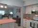 View of the kitchen leading to a cozy living room with comfortable seating and stylish decor at 2261 Swedish Dr # 37, Clearwater, FL 33763