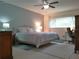 Bright primary bedroom with a queen bed, desk, and closet with lots of natural light at 2261 Swedish Dr # 37, Clearwater, FL 33763