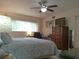 Spacious primary bedroom with a queen bed, a desk, and a dresser at 2261 Swedish Dr # 37, Clearwater, FL 33763