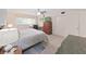 Bedroom features a neutral palette, bed, desk, and closet at 2261 Swedish Dr # 37, Clearwater, FL 33763