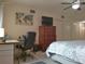 Comfortable primary bedroom with a desk, dresser, and a closet for storage at 2261 Swedish Dr # 37, Clearwater, FL 33763