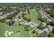 Expansive aerial view of the golf course community, highlighting the perfectly designed fairways winding through the neighborhood at 2275 Terrace View Ln, Spring Hill, FL 34606