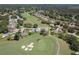 Aerial view of the property, showcasing the surrounding golf course and community at 2275 Terrace View Ln, Spring Hill, FL 34606