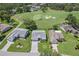 Aerial view of home with golf course in the background at 2275 Terrace View Ln, Spring Hill, FL 34606
