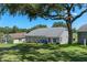 Charming home with a spacious backyard, perfect for entertaining or relaxing, with a view of the community golf course at 2275 Terrace View Ln, Spring Hill, FL 34606