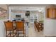 Well-appointed kitchen with breakfast bar seating and a cozy dining nook at 2275 Terrace View Ln, Spring Hill, FL 34606