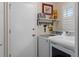 Functional laundry room with washer, dryer, and storage at 2275 Terrace View Ln, Spring Hill, FL 34606