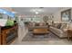 Inviting living room boasts comfortable seating, a decorative rug, and a cozy ambiance at 2275 Terrace View Ln, Spring Hill, FL 34606