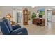 Cozy sitting area features comfortable recliners and stylish decor, enhancing the home's appeal at 2275 Terrace View Ln, Spring Hill, FL 34606