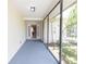 Covered and screened front entrance with a view to an open floor plan at 2414 San Luis Rd, Holiday, FL 34691