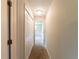 Hallway featuring a closet, carpet flooring, and access to the other rooms at 2414 San Luis Rd, Holiday, FL 34691