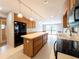Kitchen featuring stainless steel appliances, light countertops, and a large center island at 2414 San Luis Rd, Holiday, FL 34691