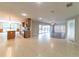 Open concept kitchen and living area filled with natural light and updated appliances at 2414 San Luis Rd, Holiday, FL 34691