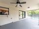 View of the cozy screened lanai, with an outdoor bar, overlooking the sparkling pool at 2414 San Luis Rd, Holiday, FL 34691