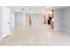 Open floor plan with tile flooring connecting multiple rooms at 2414 San Luis Rd, Holiday, FL 34691