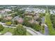 Aerial view of the complex with mature trees, landscaping, and community parking at 2500 Winding Creek Blvd # G106, Clearwater, FL 33761