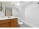 Bathroom featuring a vanity, toilet, and shower-tub combination at 2500 Winding Creek Blvd # G106, Clearwater, FL 33761
