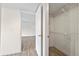 Bright bedroom closet with shelving and tile flooring at 2500 Winding Creek Blvd # G106, Clearwater, FL 33761