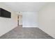 Bright bedroom features stylish tile flooring and TV at 2500 Winding Creek Blvd # G106, Clearwater, FL 33761