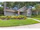 Exterior view of fitness center with lush landscaping and well-maintained lawn on a sunny day at 2500 Winding Creek Blvd # G106, Clearwater, FL 33761