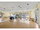 Bright fitness room with mirrors, a variety of equipment, and natural light from large windows at 2500 Winding Creek Blvd # G106, Clearwater, FL 33761