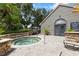 A tranquil hot tub provides residents a relaxing escape, surrounded by lush greenery and stone accents at 2500 Winding Creek Blvd # G106, Clearwater, FL 33761