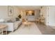 Bright living room showcasing modern furnishings and an open floor plan leading to the kitchen and dining area at 2500 Winding Creek Blvd # G106, Clearwater, FL 33761