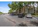 Community parking lot featuring covered spaces and reserved parking spots at 2500 Winding Creek Blvd # G106, Clearwater, FL 33761