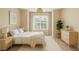 This light and airy bedroom features neutral tones, abundant natural light, and a calming ambiance at 2500 Winding Creek Blvd # I106, Clearwater, FL 33761