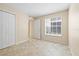 Bright bedroom featuring a closet and tile floor at 2500 Winding Creek Blvd # I106, Clearwater, FL 33761