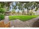 Lush courtyard with manicured lawn, brick-paved walkways, covered seating and serene green space at 2500 Winding Creek Blvd # I106, Clearwater, FL 33761