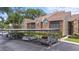 View of condo units, carport, landscaping and reserved parking spots at 2500 Winding Creek Blvd # I106, Clearwater, FL 33761